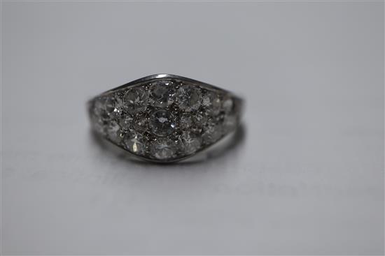 A white metal and diamond cluster set elliptical shaped ring, size H/I.